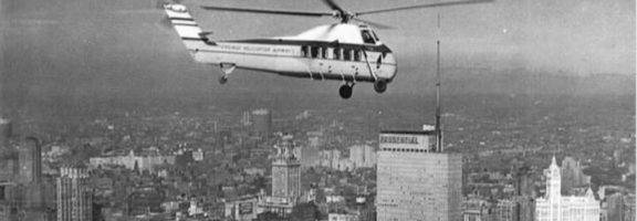 A Chicago Helicopter Airways Sikorsky S-58C passing over a mid-20th century Chicago skyline.